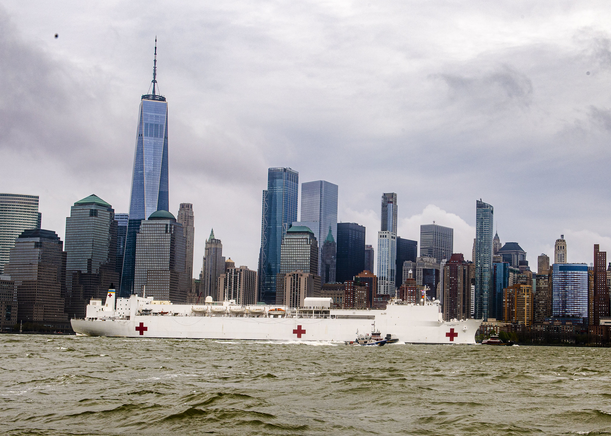 The hospital ship USNS Comfort (T-AH 20) departs New York Harbor