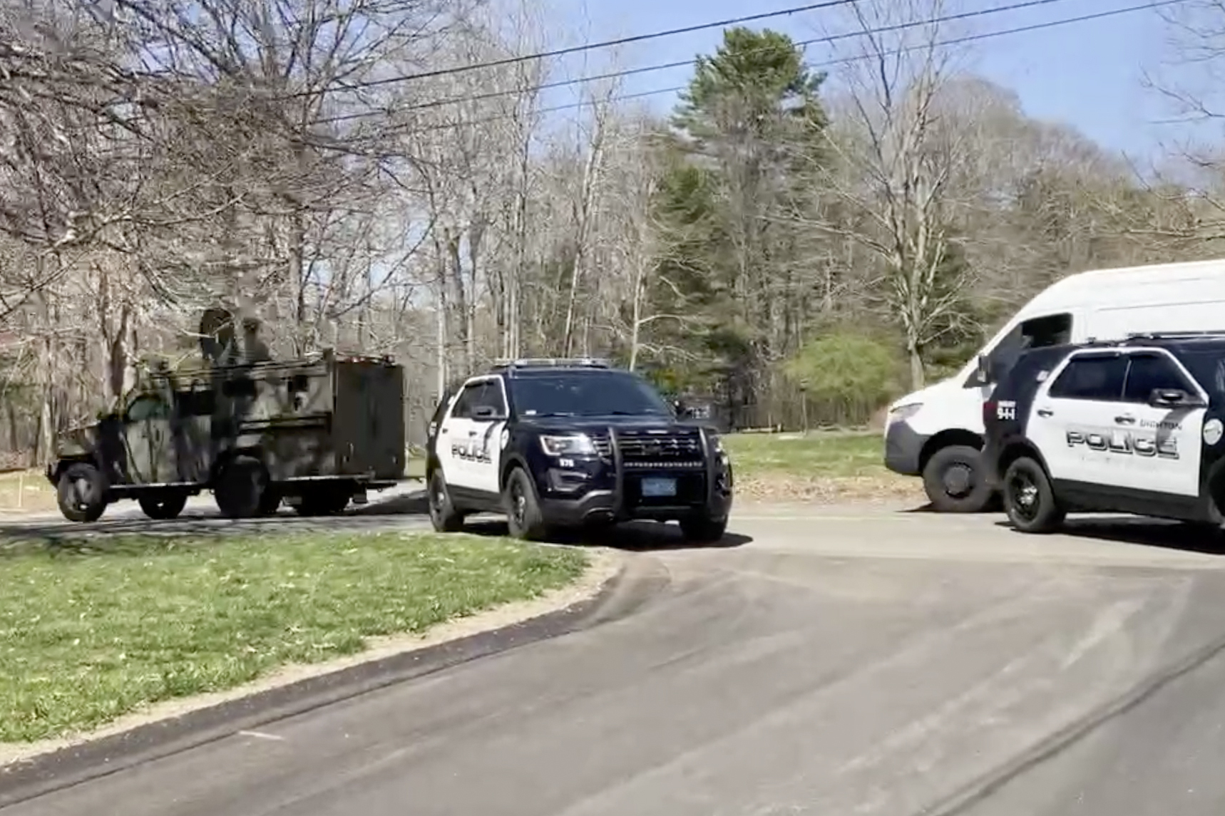 In this image taken from video, police block a road in North Dighton, Mass., Thursday, April 13, 2023.